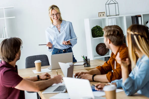 depositphotos_201320588-stock-photo-colleagues-working-startup-project-office