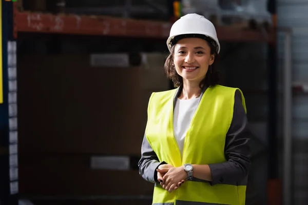 depositphotos_690636384-stock-photo-cheerful-professional-woman-safety-vest