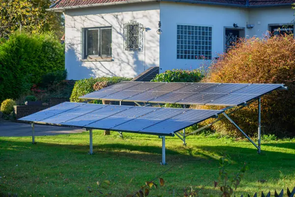 depositphotos_758645798-stock-photo-solar-panels-mounted-ground-yard